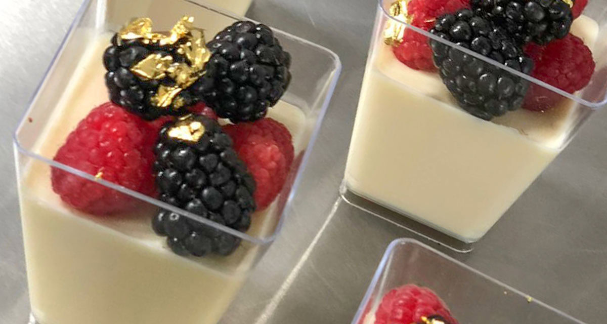 close up of berry and pudding dessert